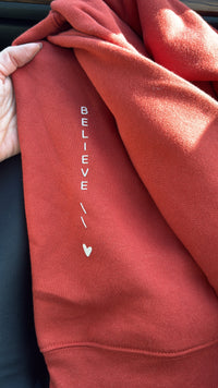 Believe Crewneck (brick)